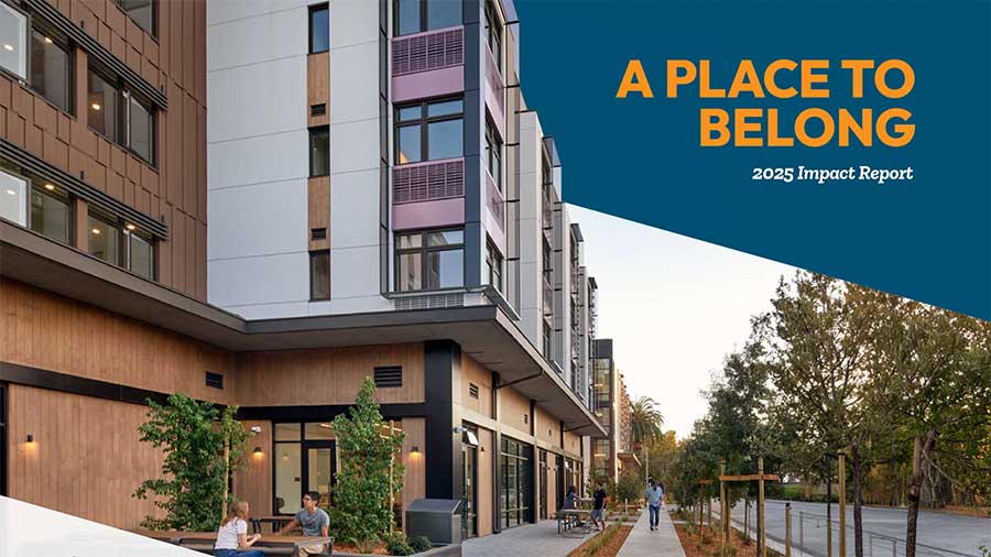Modern apartment building with people sitting at an outdoor table; trees line the sidewalk. Text reads: A Place to Belong - 2025 Impact Report.