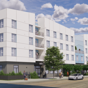 Modern four-story apartment building with white exterior, large windows, and balconies offers convenient housing. People are walking, cycling, and sitting outside; a car is parked on the street under a partly cloudy sky.