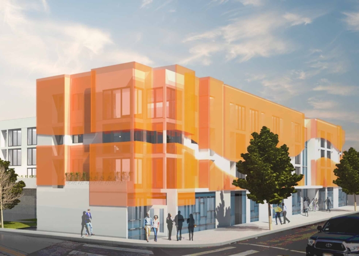 Coming Soon: Manchester Urban Homes. Corner angle of building with orange facade and people gathering at the ground level.