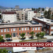 Harrower Village Grand Opening Video. Drone shot overlooking City of Glendale with brick historic building in foregrant.