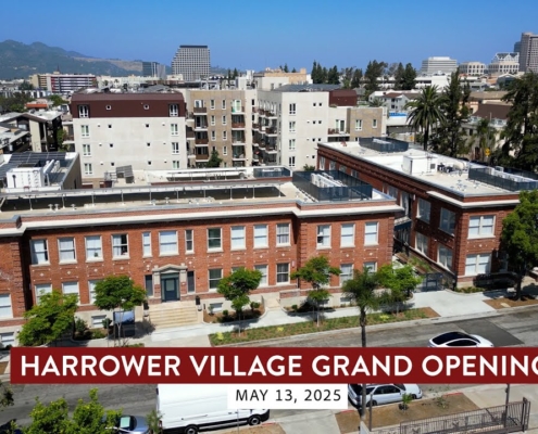 Harrower Village Grand Opening Video. Drone shot overlooking City of Glendale with brick historic building in foregrant.