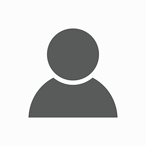 A simple gray user icon on a white background, featuring a circular head and rectangular shoulders, often used as a generic profile or avatar image for platforms highlighting Ways to Give.